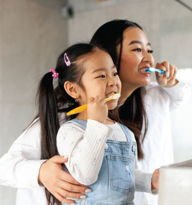 Family smiling at Firestone Dental Care